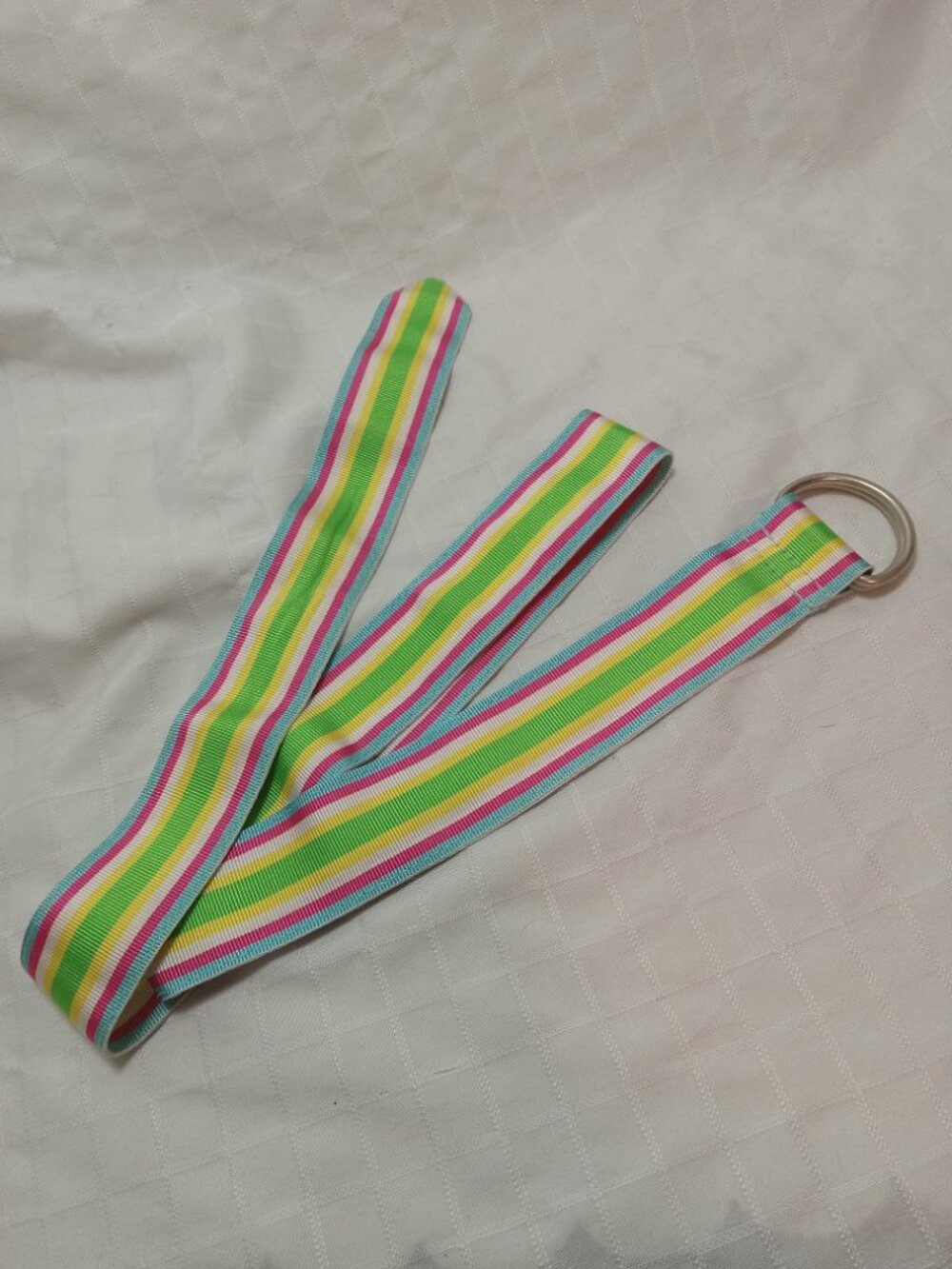 Vintage woven belt with pink, green, blue, white, and yellow stripes in perfect